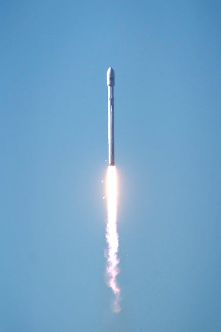 A rocket launching into the clear blue sky